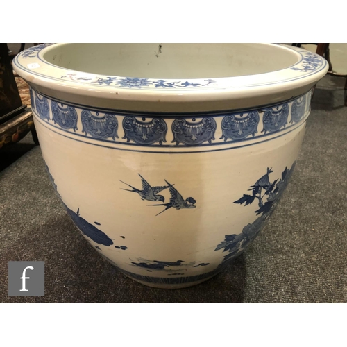 214 - A Chinese blue and white porcelain fish bowl, the large vessel decorated to the exterior with a cont... 