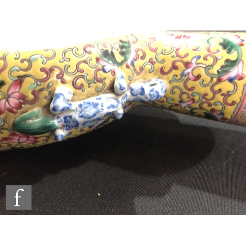 202 - A Chinese yellow ground famille rose moonflask, the porcelain flask rising from a high foot and flan... 