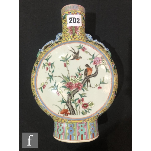 202 - A Chinese yellow ground famille rose moonflask, the porcelain flask rising from a high foot and flan... 