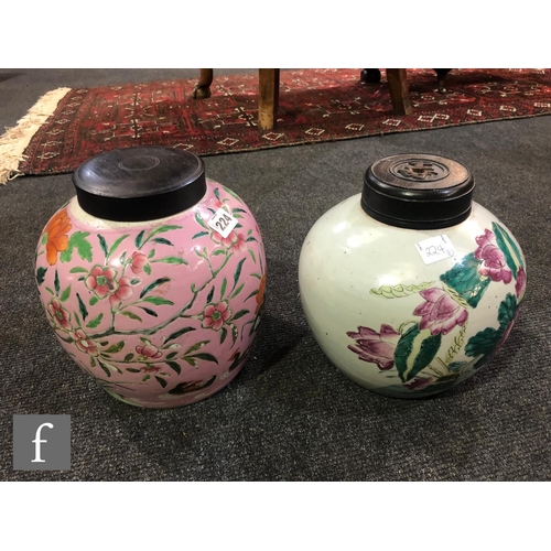 224 - Two Chinese famille rose vases, each of ovoid form, the first with a pink ground detailed with flowe... 