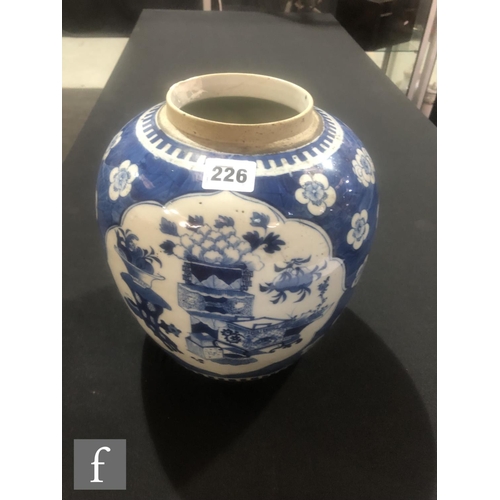 226 - A Chinese 19th Century blue and white jar, the cracked ice ground picked out with lotus blooms, the ... 