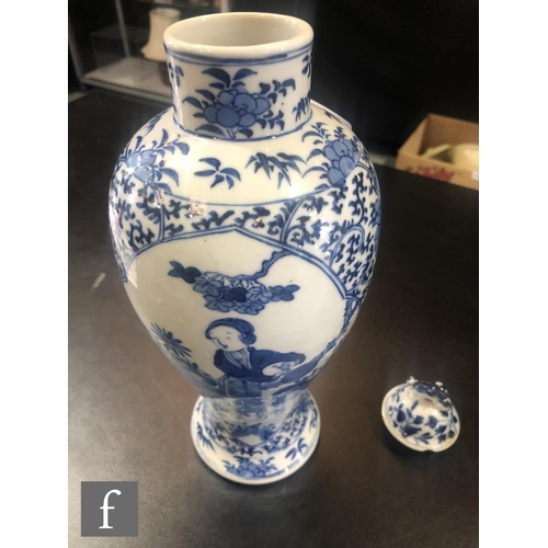 196 - A pair of Chinese blue and white vases of baluster form, rising to a high footring and rising from a... 