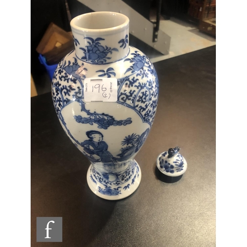 196 - A pair of Chinese blue and white vases of baluster form, rising to a high footring and rising from a... 