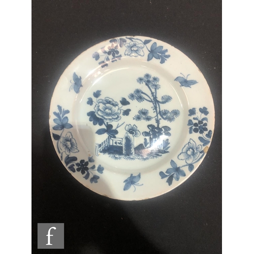 84 - Three assorted 19th Century tin glazed plates decorated in blue and white with Chinoiserie roundels,... 