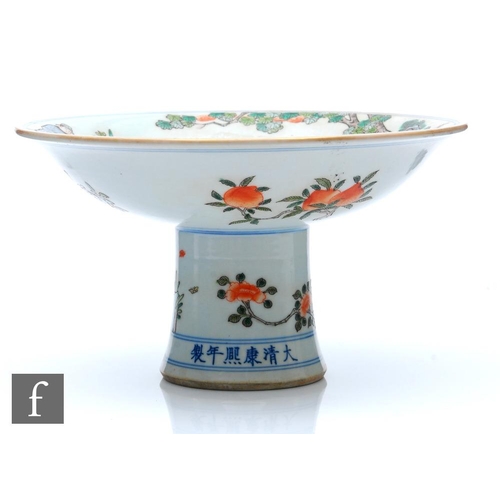 173 - A Chinese porcelain famille verte stem cup, the splayed base extending to a circular shallow upper d... 