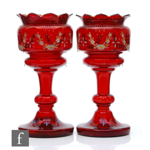 236 - A pair of late Victorian ruby glass table lustres with wide circular foot rising to a knopped stem a... 