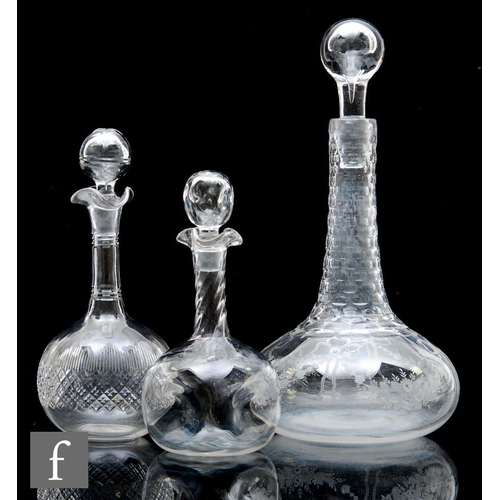 323 - A 20th Century clear crystal glass decanter of squat ovoid form, the body decorated with engraved bo... 