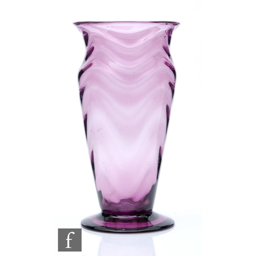 324 - A large 1930s optic vase, possibly Thomas Webb, in deep amethyst with wave ribbed drapery design, he... 