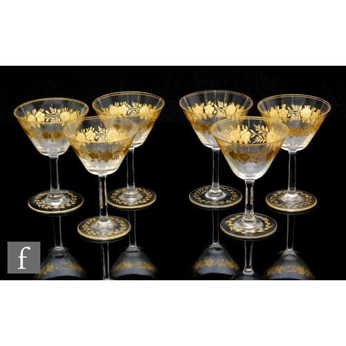 332 - A set of six early 20th Century clear crystal wine glasses circa 1900, possibly Moser, the conical b... 