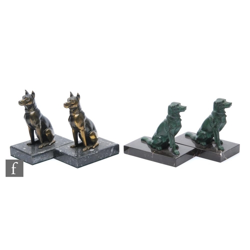 908 - A pair of 20th Century spelter bookends, depicting green painted stylised seated retrievers, mounted... 