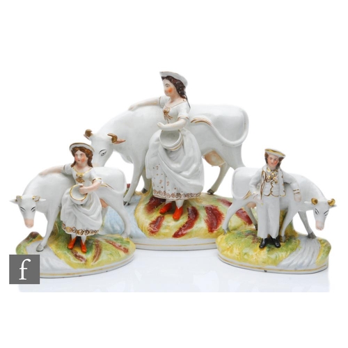 104 - A 19th Century garniture of Staffordshire figures comprising a large central model of a milkmaid hol... 