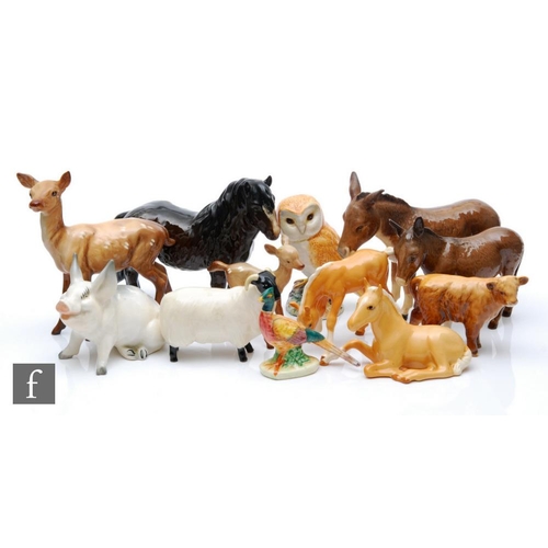 128 - A collection of assorted Beswick animals to include donkeys, foals, an owl and a deer, all with prin... 