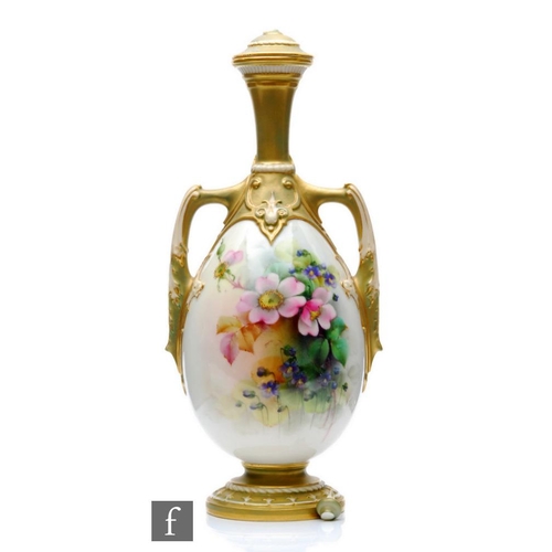 63 - An early 20th Century Royal Worcester shape 2194 twin handled vase and cover panel decorated by Cole... 