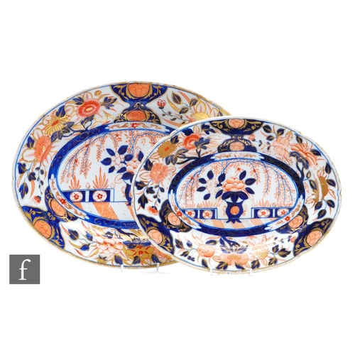 93 - Two graduated 19th Century Chinoiserie meat plates decorated in the Imari palette, both unmarked, po... 