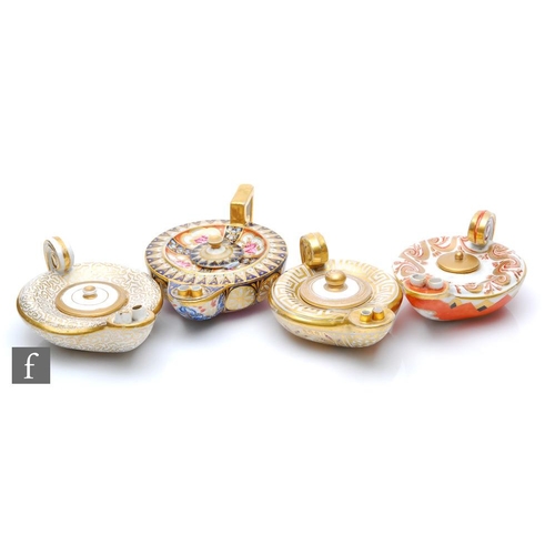 51 - Four 19th Century oil lamps modelled on Roman oil lamps each with gilt and enamel decoration, all un... 
