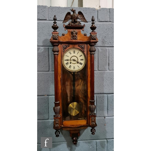 830 - A late 19th Century walnut cased Vienna regulator wall clock, the spring driven movement enclosed by... 