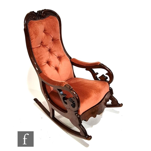 1130 - An early Victorian rocking chair with exposed mahogany frame, with acanthus leaf top rail over pierc... 