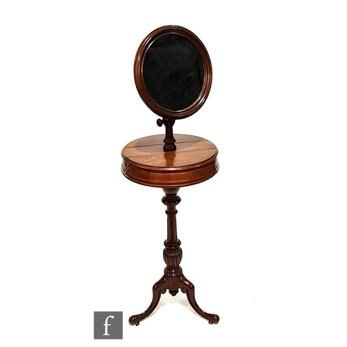 1148 - A Victorian mahogany shaving stand with adjustable circular mirror above twin compartments, all over... 