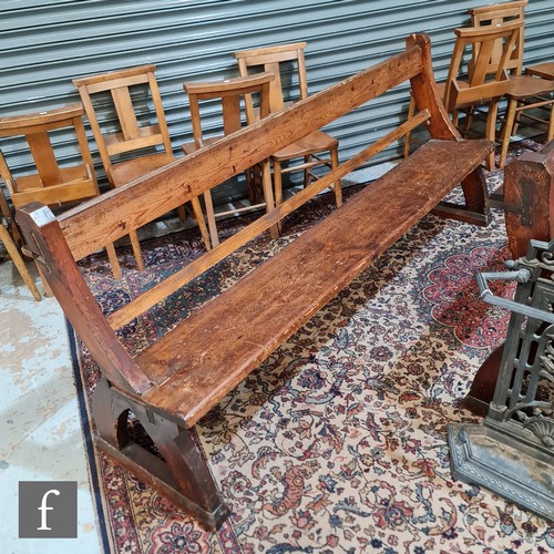 1126 - Two late 19th to early 20th Century pitch pine church pews, with open rail backs and end supports, l... 