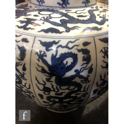 179 - A large Chinese blue and white vase of rounded ovoid form, rising from a spreading circular footring... 