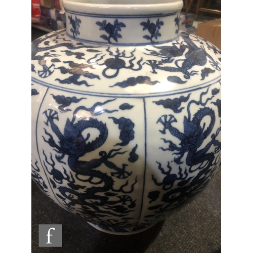 179 - A large Chinese blue and white vase of rounded ovoid form, rising from a spreading circular footring... 