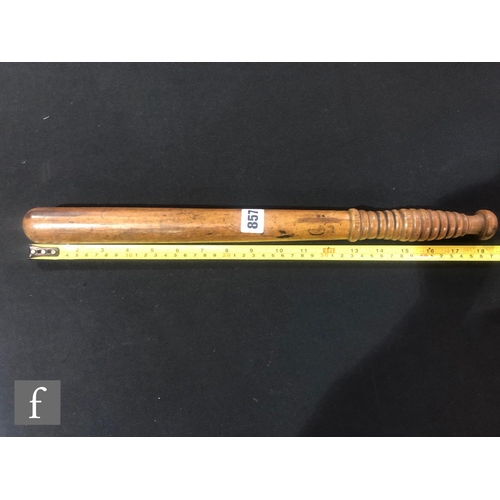 857 - An early to mid 20th Century policeman’s truncheon with ribbed handle, length 37cm, and a similar tr... 