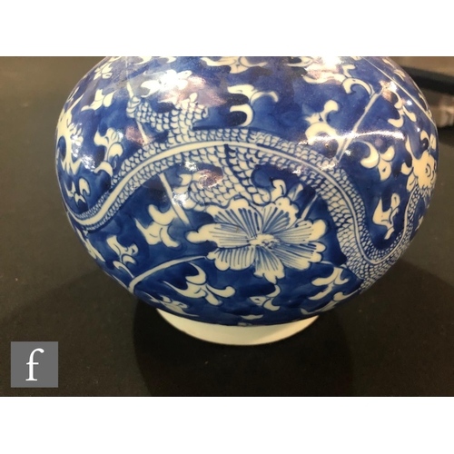 168 - A Chinese blue and white double-gourd vase, the body with a rich cobalt ground, picked out with drag... 