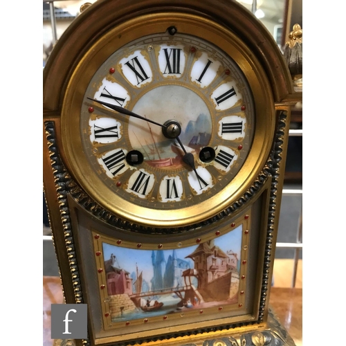 837 - A late 19th Century French clock garniture, with painted porcelain panels depicting canal scenes, wi... 