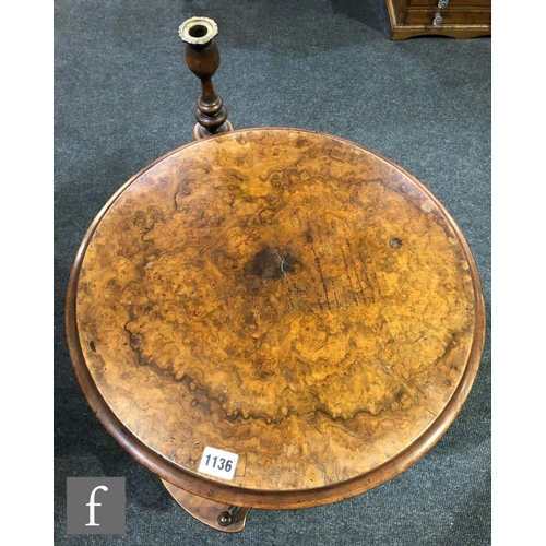 1136 - A Victorian walnut reading or book table, with fitted candle stand over two-tier revolving galleried... 