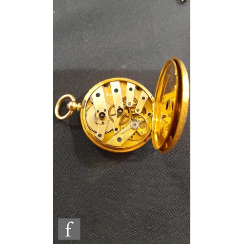 653 - An 18ct open faced key wind fob watch, Roman numerals to a gilt dial, case diameter 40mm, gold dust ... 