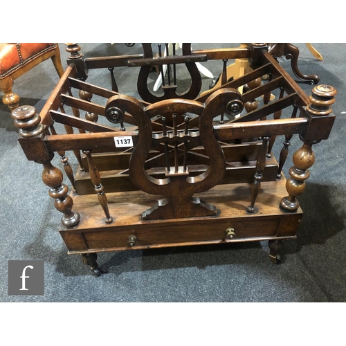 1137 - A 19th Century rosewood four division Canterbury, with lyre shaped end supports above a single friez... 