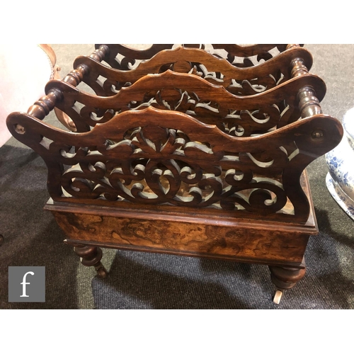 1139 - A Victorian walnut three-division Canterbury, with fret-cut divisions over a single frieze drawer, h... 