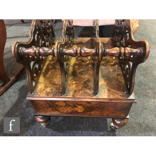 1139 - A Victorian walnut three-division Canterbury, with fret-cut divisions over a single frieze drawer, h... 