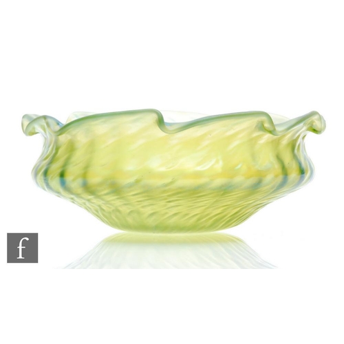 64 - Kralik - A late 19th Century glass bowl of waisted form, wrythen moulded with frill rim, all in an i... 