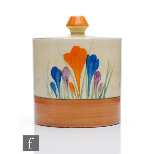 355 - Clarice Cliff - Crocus - A size 3 Drum shaped preserve pot circa 1930, hand painted with Crocus spra... 