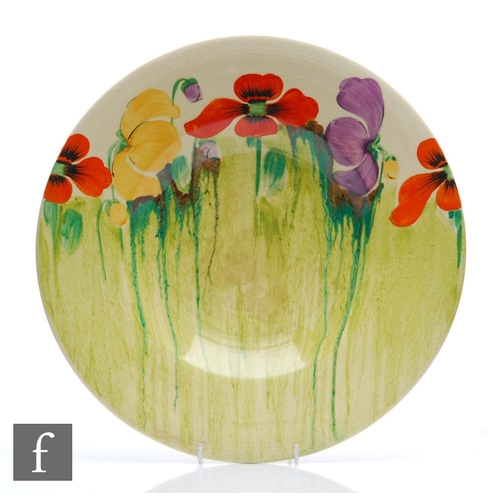 359 - Clarice Cliff - Delecia Poppy - A 13 inch ribbed charger circa 1935, hand painted with stylised popp... 