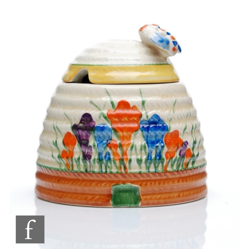 378 - Clarice Cliff - Crocus - A large Beehive honey pot circa 1930, hand painted with Crocus sprays betwe... 