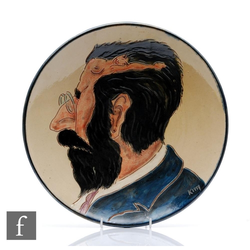 847 - Unknown - A 20th Century German Studio ceramic charger, incised with a male portrait in profile with... 