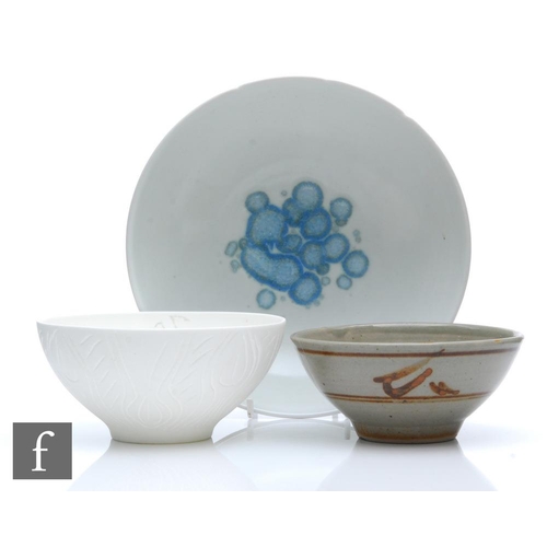 1202 - Unknown - Three later 20th Century studio pottery bowls, the first by Paul Swan in white with incise... 