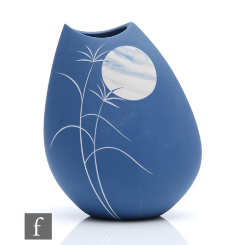 1205 - Sue Dyer - A contemporary studio pottery vase of compressed form decorated with incised grasses in w... 