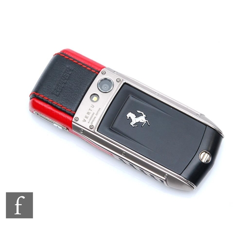 1228 - Vertu - An Ascent Ti Special Edition Ferrari mobile phone made from titanium with black and red deta... 