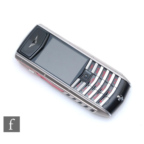 1228 - Vertu - An Ascent Ti Special Edition Ferrari mobile phone made from titanium with black and red deta... 