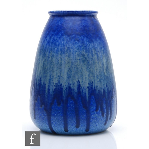 136 - Ruskin Pottery - A large crystalline glaze vase of tapering barrel form decorated in a blue over gre... 