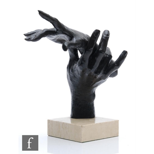 1438 - G Mariani - A contemporary bronze sculpture modelled as a male hand holding a female hand, on a squa... 