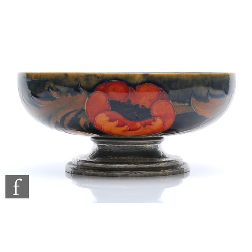 146 - William Moorcroft - Liberty & Co - A pedestal bowl decorated in the Big Poppy pattern with flowe... 