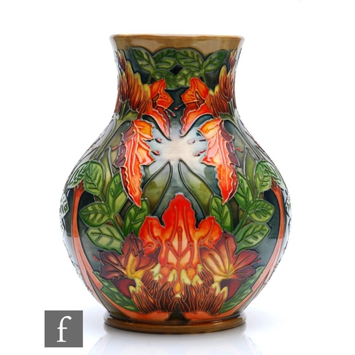 160 - Philip Gibson - Moorcroft Pottery - A baluster vase decorated in the Flame of the Forest pattern, im... 