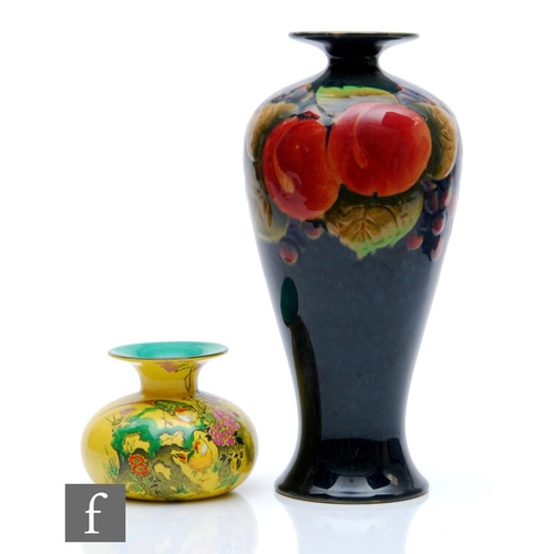 427 - Shelley - A 1920s/1930s vase decorated with a band of pomegranates and berries against a blue ground... 