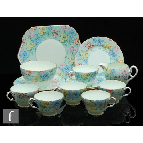 428 - Shelley - A 1930s Art Deco part teaset decorated in the Chintz Melody pattern comprising six Henley ... 