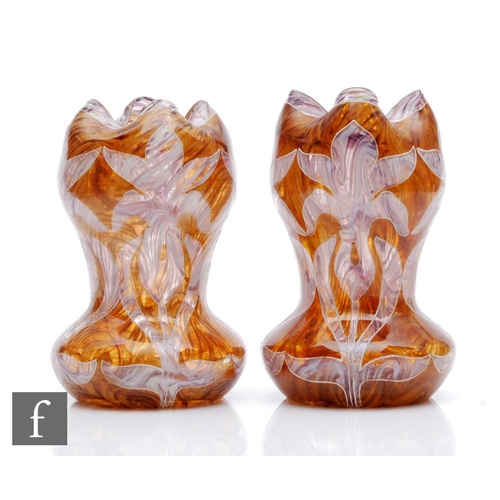 61 - Harrach - A pair of late 19th Century Bohemian glass vases, each of waisted form with triform red ri... 