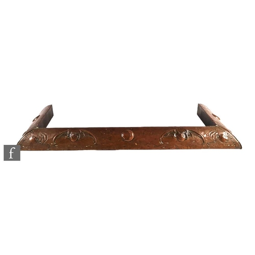 88 - In the manner of John Pearson - An early 20th Century Arts and Crafts copper fire fender with bats a... 